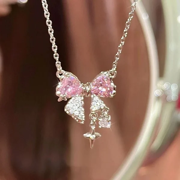 collier pendentif nœud rose